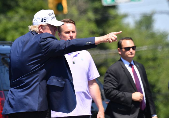 President Donald Trump greets supporters after leaving Trump National Golf Club in Bedminster, New Jersey, on July 26.