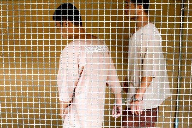 Myanmar migrant workers Zaw Lin and Win Zaw Htun leave after a hearing at the Nonthaburi provincial court in Thailand, August 29, 2019.