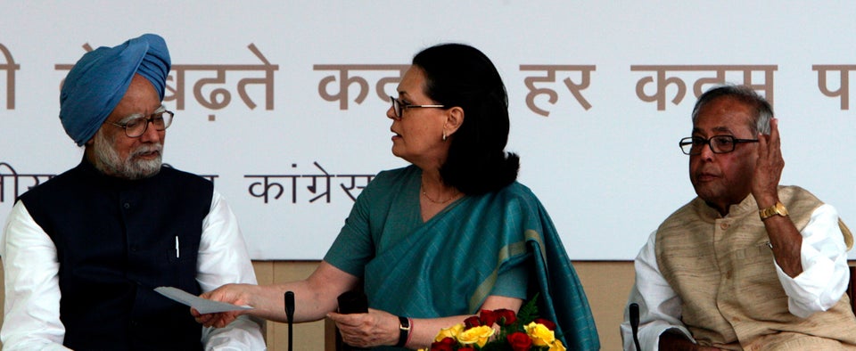 A 2009 photo of Sonia Gandhi speaking to then Prime Minister Manmohan Singh as Foreign Minister Mukherjee...