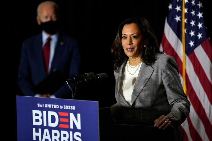 Presumptive Democratic presidential nominee Joe Biden (left) looks on as his running mate, Sen. Kamala Harris, speaks in Delaware last week. Harris' eligibility to serve as VP was recently questioned in an opinion piece that targeted her parents' immigration status at the time of her birth in California.