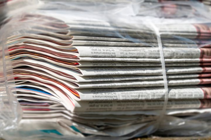 Stack of bundled newspapers, ready to be delivered