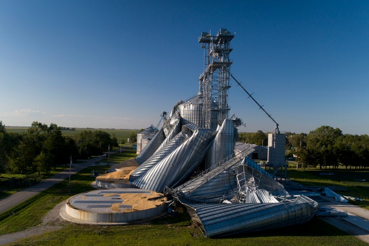 Damaged grain bins are shown at the Heartland Co-Op grain elevator on August 11 in Luther, Iowa. Iowa Gov. Kim Reynolds said about a third of the state’s land used for corn crops was damaged from last week's storm.