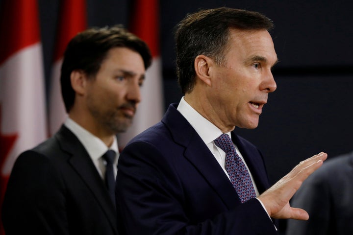 Federal Finance Minister Bill Morneau addresses the media during a news conference on March 11 in Ottawa with Prime Minister Justin Trudeau behind him. Morneau has been finance minister since the Liberals took power in late 2015.