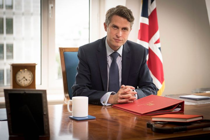 Gavin Williamson poses for a photo in his office at the Department of Education in London following the announcement that A-level and GCSE school results in England will now be based on teachers' assessments of their students.
