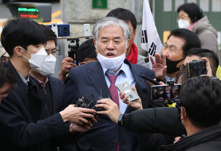 In this April 20, 2020, photo, Sarang Jeil Church pastor Rev. Jun Kwang-hun speaks outside a detention center in Uiwang, Sout