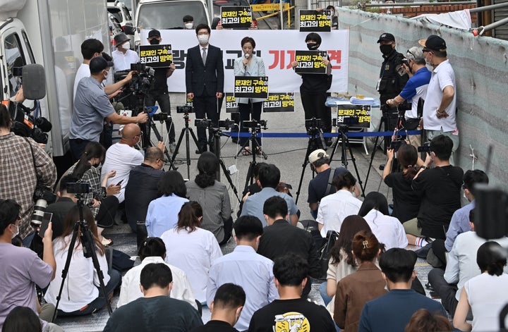 A lawyer for Sarang Jeil Church holds a press conference near the church in Seoul on August 17, 2020. 