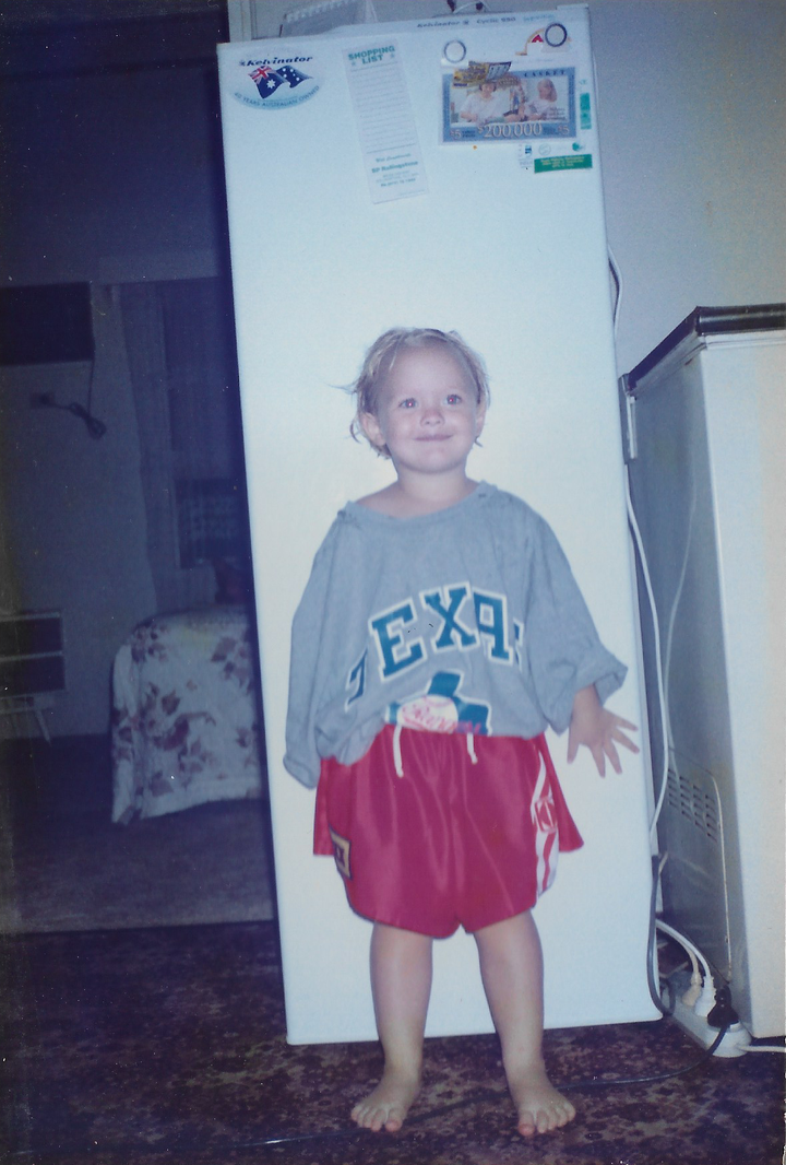 Me in my older brother's football gear at age three.