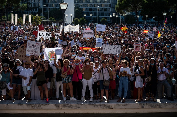 Protesters in Madrid rally against the mandatory use of face masks and other measures adopted by the Spanish government to prevent the spread of coronavirus, Aug. 16.