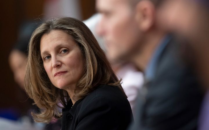 Deputy Prime Minister Chrystia Freeland listens to a speaker during a news conference in Ottawa on April 7, 2020. 