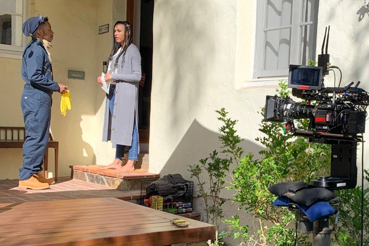 Leslie Odom Jr. and Nicolette Robinson act in front of a robotic camera. 