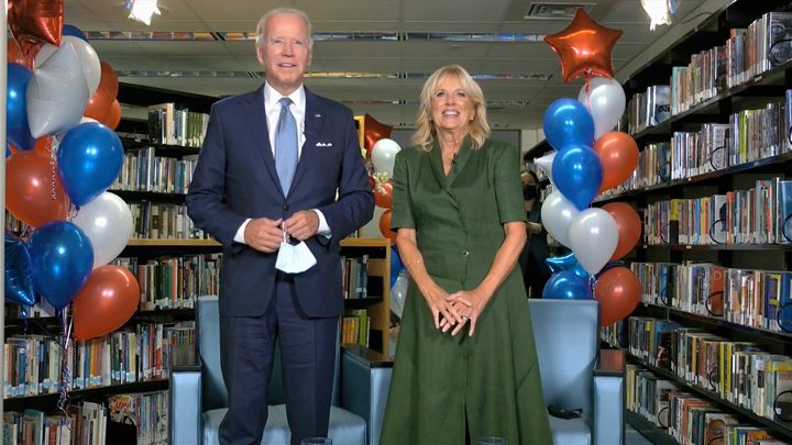 In this image from video, former Vice President Joe Biden, his wife, Jill Biden, and members of their family celebrate after the roll call makes him the official presidential nominee of the party Tuesday on the second night of the Democratic National Convention.