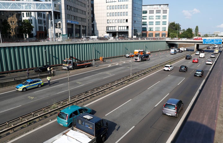 A general view shows police officers investigating the scene of a series of allegedly deliberate car crashes on highway A100 in Berlin, Germany, August 19.