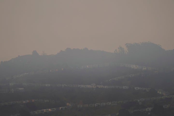 Smoke from wildfires hangs over homes in San Francisco, Wednesday, Aug. 19, 2020. (AP Photo/Jeff Chiu)