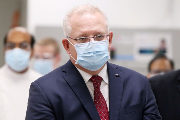 Prime Minister Scott Morrison is seen wearing a face mask during a press conference at AstraZeneca on August 19, 2020 in Sydney, Australia. The Australian government has announced an agreement with the British pharmaceutical giant AstraZeneca to secure at least 25 million doses of a COVID-19 vaccine if it passes clinical trials.