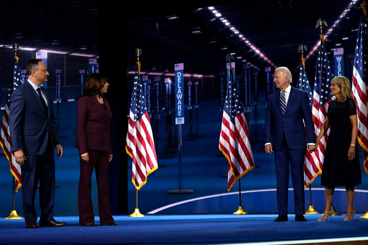 Democratic vice presidential candidate Sen. Kamala Harris (D-Calif.) and her husband, Doug Emhoff, are joined on stage Wednes