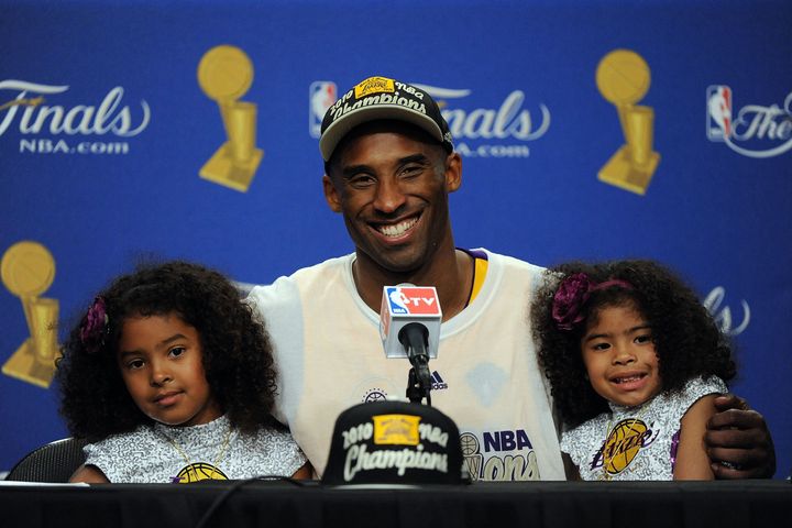 Kobe Bryant speaks during the post-game news conference with daughters Natalia and Gianna after the Los Angeles Lakers defeated the Boston Celtics in Game 7 of the 2010 NBA Finals.