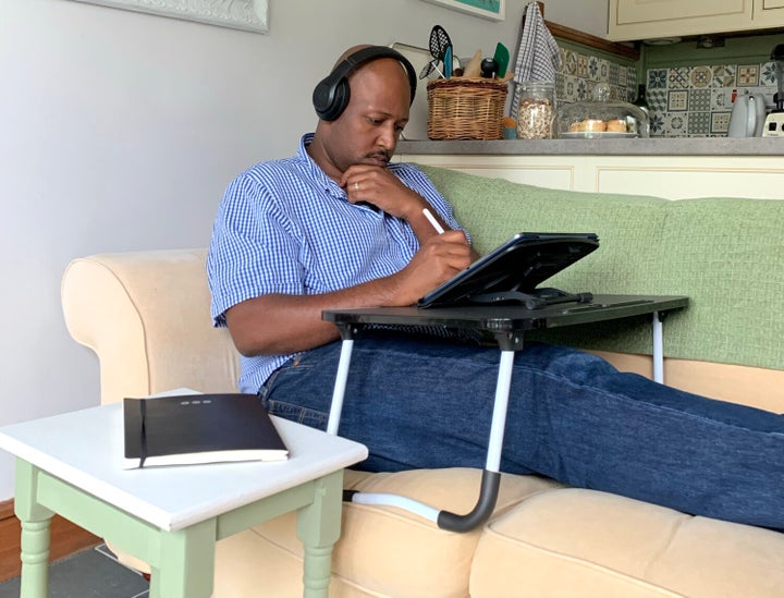 Christian working from their Airbnb. 