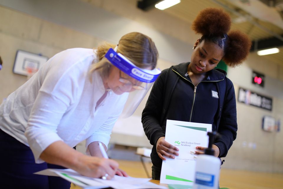 A student collecting her GCSE results in London – but BTec students will not get their grades on results day