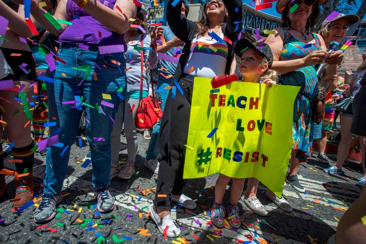 A young child holds a sign during the annual LA Pride Parade in West Hollywood on June 9, 2019.