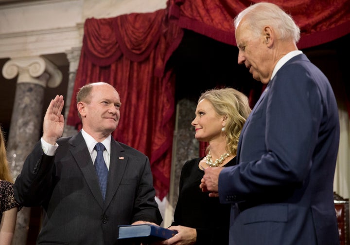 In this Jan. 6, 2015, file photo, Vice President Joe Biden administers the Senate oath to Sen. Chris Coons in the Old Senate Chamber on Capitol Hill in Washington. 