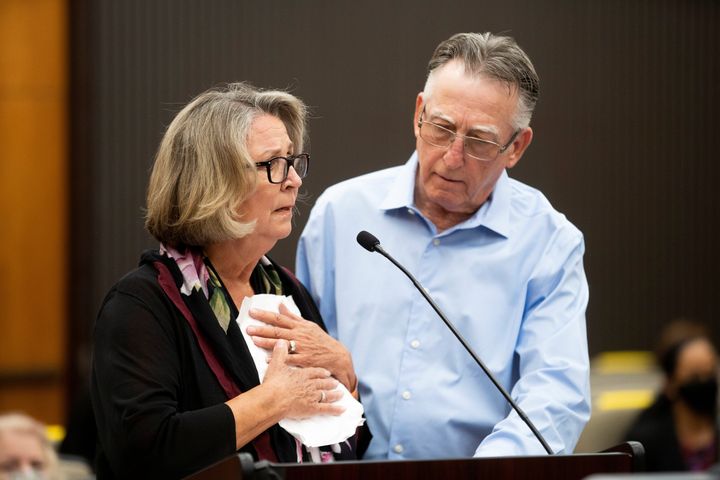 Gay Hardwick is comforted by her spouse Robert Hardwick as they confront their attacker Joseph James DeAngelo, known as the Golden State Killer, on the second day of victim impact statements.