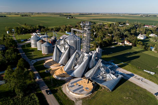 Damaged grain bins are shown at the Heartland Co-Op grain elevator on Aug. 11, in Luther, Iowa, after...