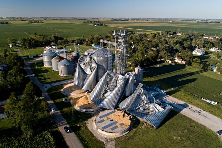 Damaged grain bins are shown at the Heartland Co-Op grain elevator on Aug. 11, in Luther, Iowa, after a powerful derecho battered the region. An estimated 8,200 homes were destroyed or extensively damaged.