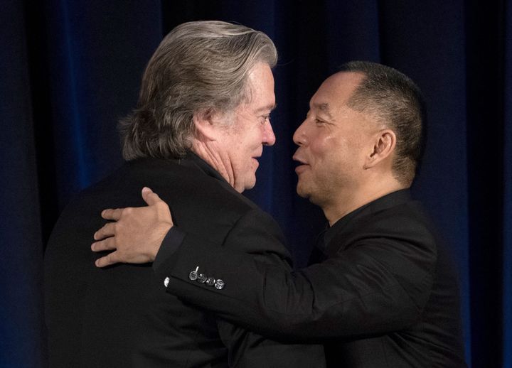 Former White House strategist Steve Bannon greets fugitive Chinese billionaire Guo Wengui before introducing him at a news conference on Nov. 20, 2018.