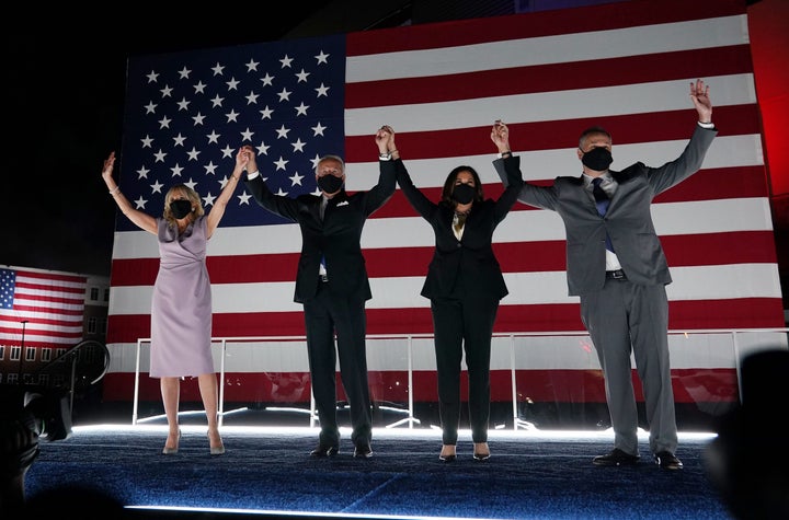 Jill Biden, presidential nominee Joe Biden, vice presidential nominee Kamala Harris and her husband, Douglas Emhoff, greet supporters in Wilmington, Delaware, on Thursday.