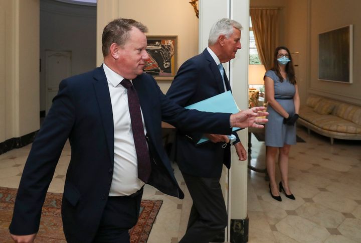 European Union chief Brexit negotiator Michel Barnier, centre, and the British Prime Minister's Europe adviser David Frost, left, arrive for Brexit trade talks between the EU and the UK, in Brussels, Friday August 21