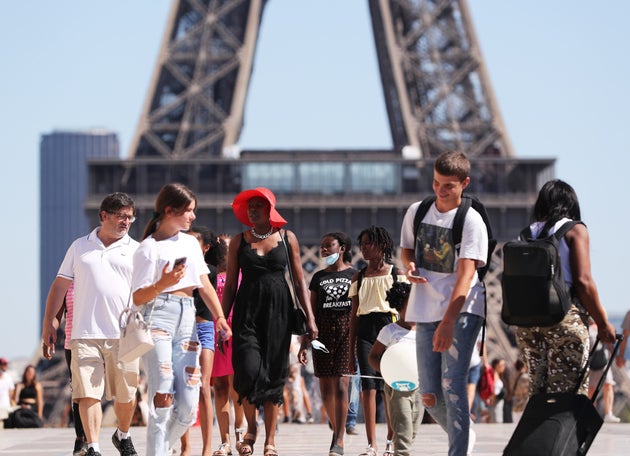 People enjoy the summer weather in Paris, France, on August