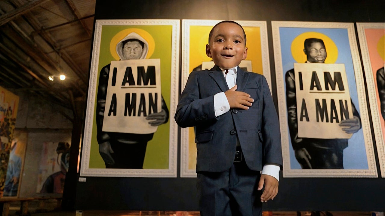 In this image from video, Cedric Richmond Jr., recites the Pledge of Allegiance in front of images of civil rights movement protestors during the fourth night of the Democratic National Convention on Aug. 20, 2020.