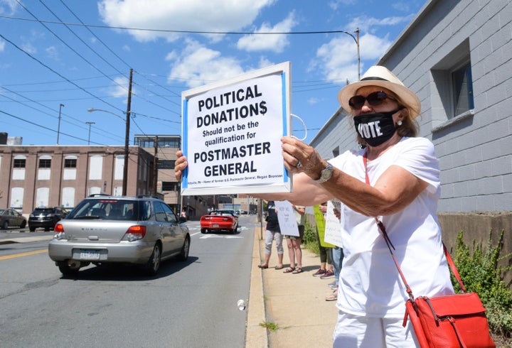 Protestors have targeted Postmaster General Louis DeJoy's political contributions to President Donald Trump.