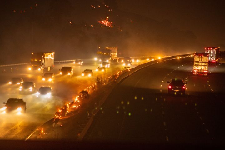 Traffic begins to move in both directions again as hot spots continue burning guardrails after the LNU Lightning Complex Fire forced the I-80 freeway to temporarily shut down in Fairfield, California, on Aug. 19.