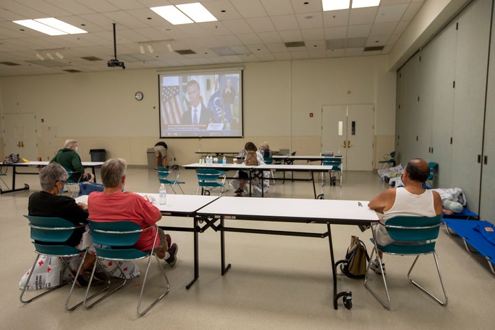 Wildfire evacuees sit at a Red Cross center set up in Vacaville, California, on Aug. 19. At least 50 structures had burned to the ground in the LNU Lightning Complex Fire as of Wednesday morning, with many more damaged or threatened.