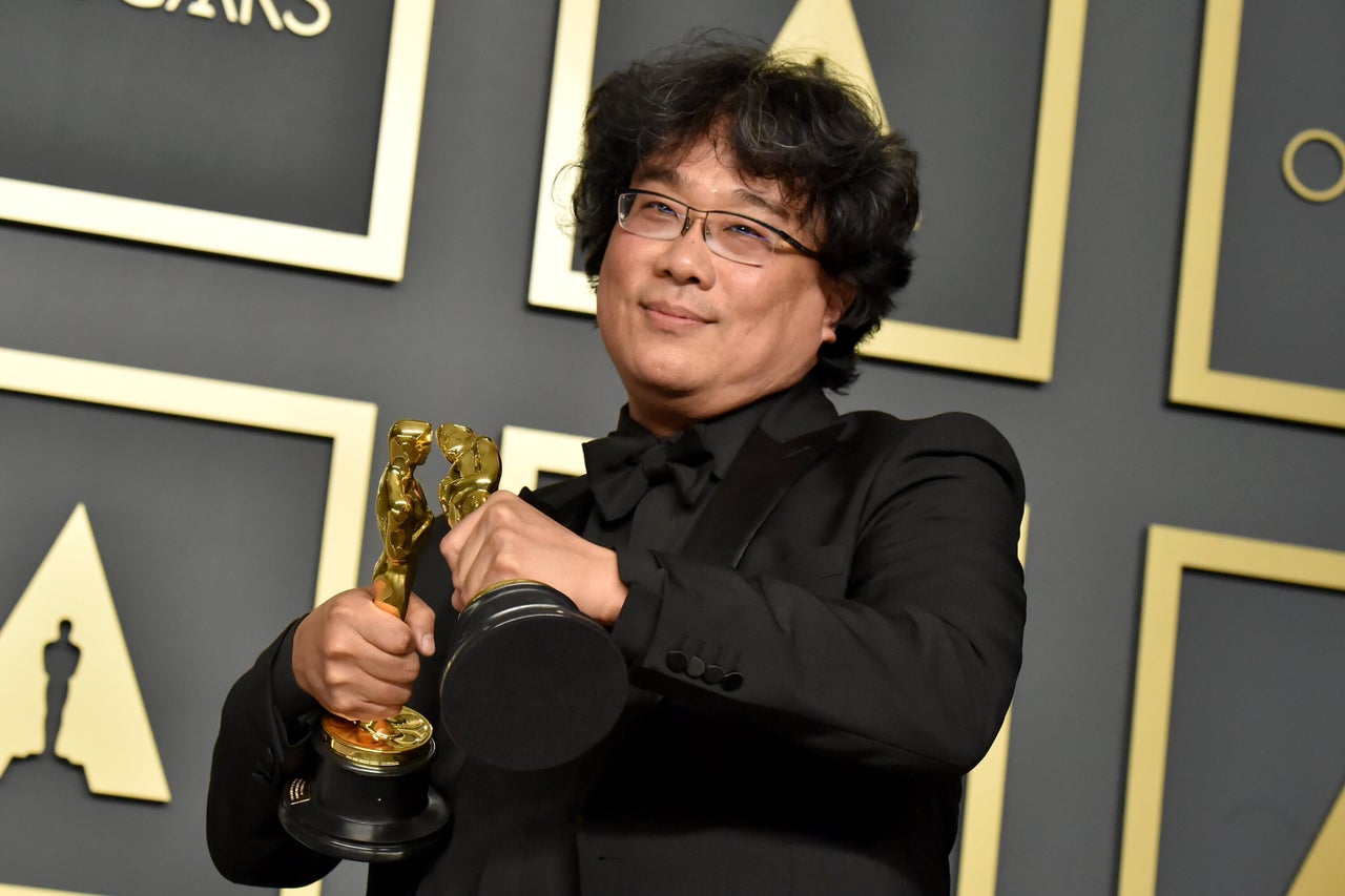 Bong Joon Ho with two of his Oscars for "Parasite" at the 2020 Academy Awards.