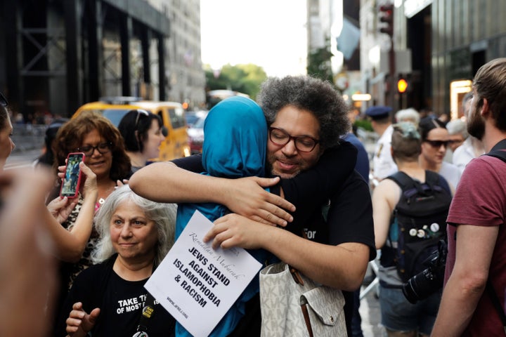Activist Linda Sarsour hugs a friend as she prepares for the beginning of a demonstration and Iftar celebration during Ramadan outside of Trump Tower in New York on June 1, 2017.