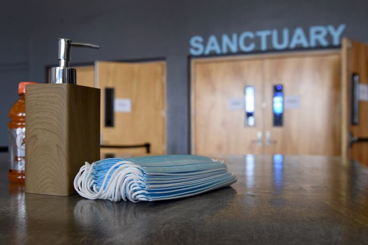 Hand sanitizer and face masks are placed on tables at the sanctuary entrance of a church in Las Vegas on May 31.