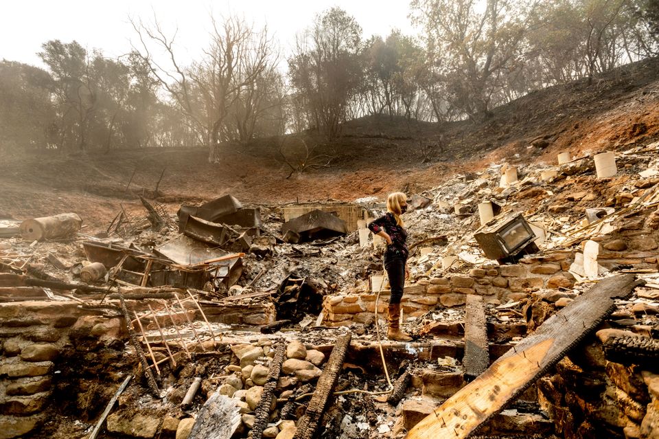 Pam, who declined to give a last name, examines the remains of her partner's Vacaville, California. 