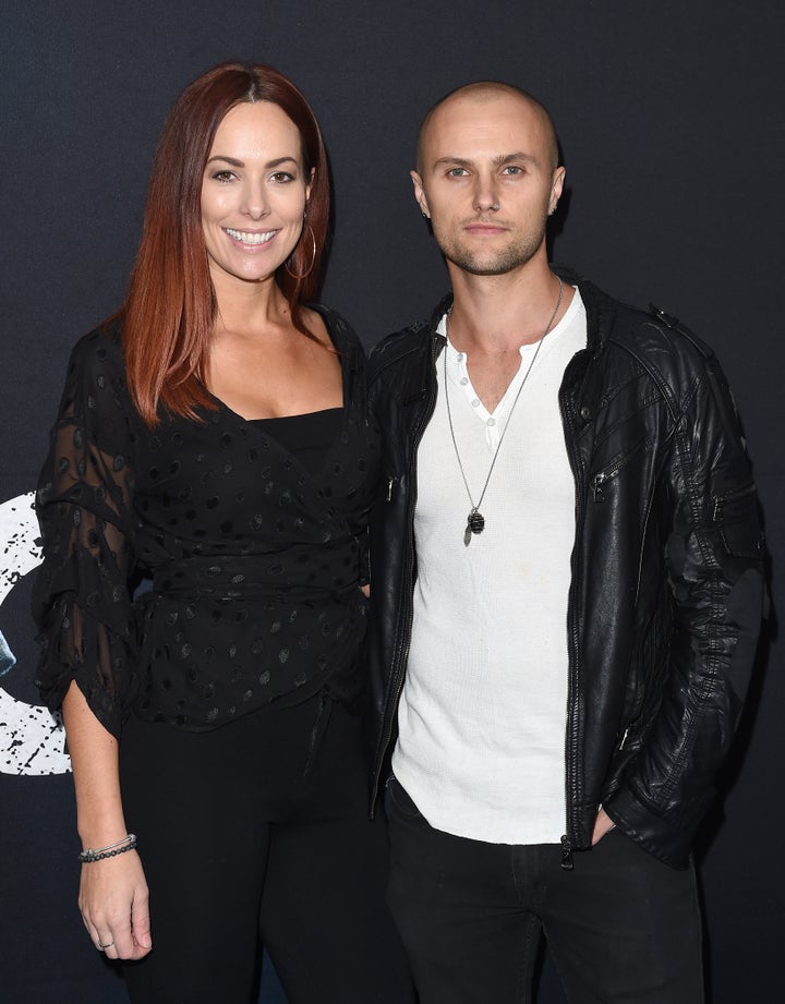 Actor Mark Furze (L) and Laural Barrett arrive at Universal Pictures' special screening of 'Breaking In' at ArcLight Cinemas on May 1, 2018 in Hollywood, California. 