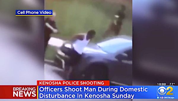 A video posted on social media showed Kenosha, Wisconsin police officers shoot at a man’s back seven times as he leaned into a vehicle