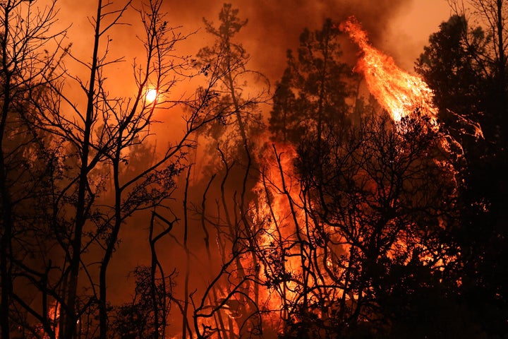 Flames and smoke from the CZU Lightning Complex wildfire turned the sky orange. (Photo by Shmuel Thaler/MediaNews Group/Santa Cruz Sentinel via Getty Images)