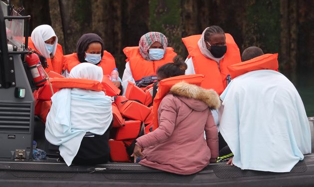 A group of people thought to be migrants are brought into Dover, Kent, by Border Force officers 