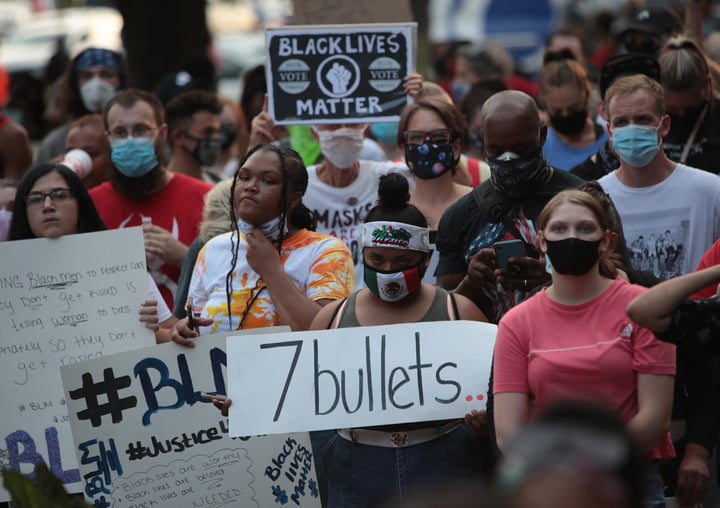 Demonstrators gather in front of the Kenosha County Court House to protest against the police shooting of Jacob Blake on August 24, 2020 in Kenosha, Wisconsin. 