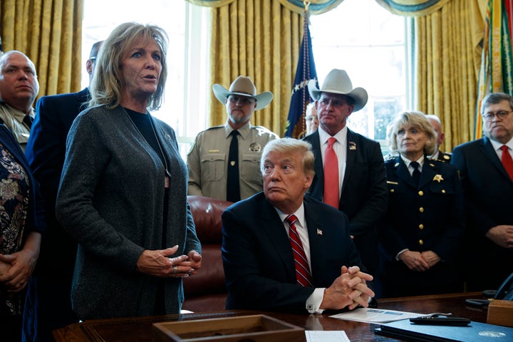 President Donald Trump listens to Mary Ann Mendoza in the Oval Office on March 15, 2019.