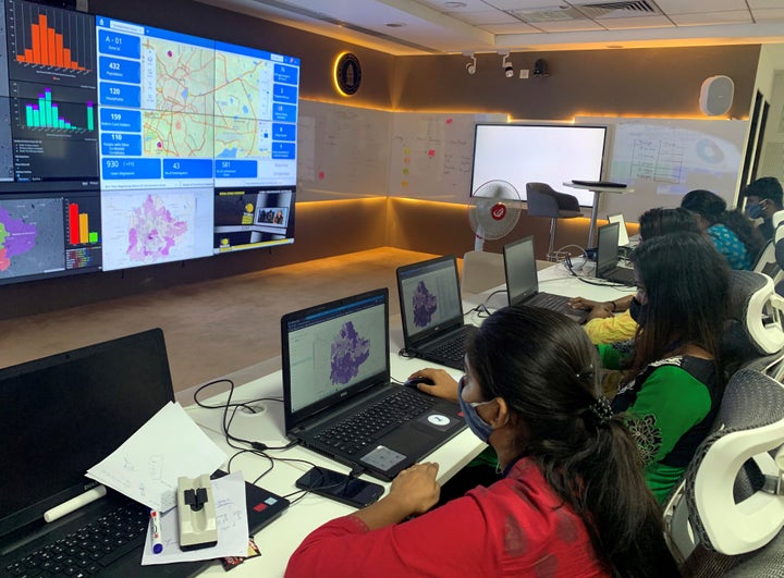 Software professionals assisting municipal authorities work on their terminals inside a "war room" focused on tracking the spread of the coronavirus disease at the Bruhat Bengaluru Mahanagara Palike office in Bengaluru on July 2, 2020.