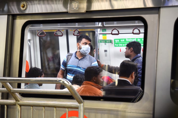 Commuters seen at Rajiv Chowk Metro Station on March 13, 2020 in New Delhi.