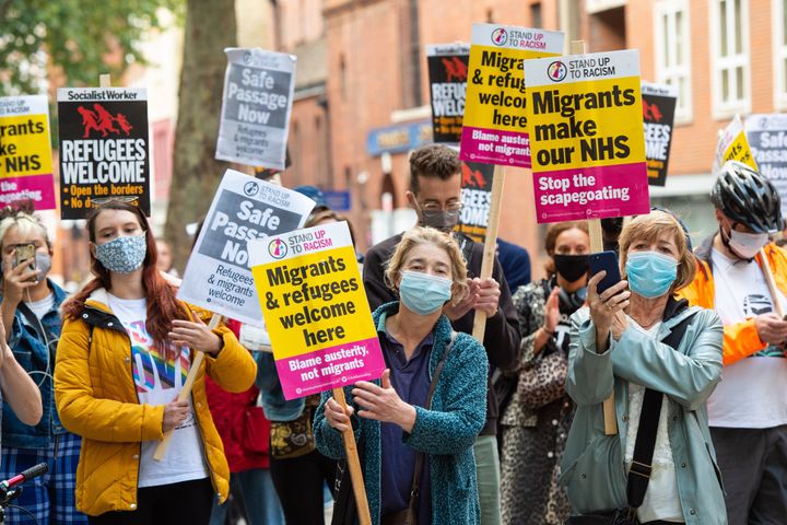 Campaigners protest outside the Home Office in central London on Tuesday to demand safe passage for migrants across the English Channel.
