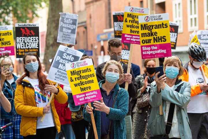 Campaigners protest outside the Home Office in central London on Tuesday to demand safe passage for migrants across the English Channel.