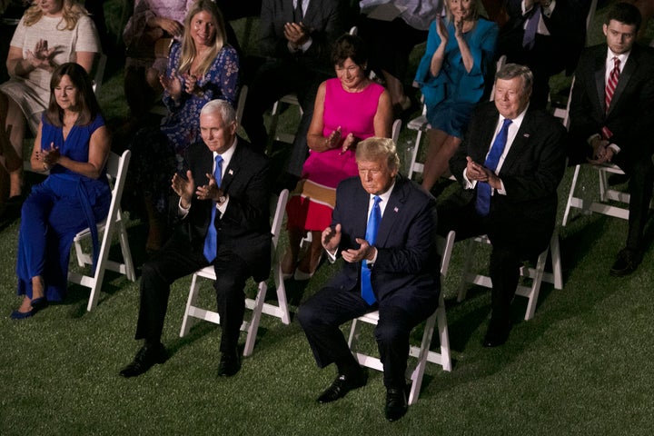 President Donald Trump and Vice President Mike Pence sit in the audience during Melania Trump’s Republican National Convention speech.